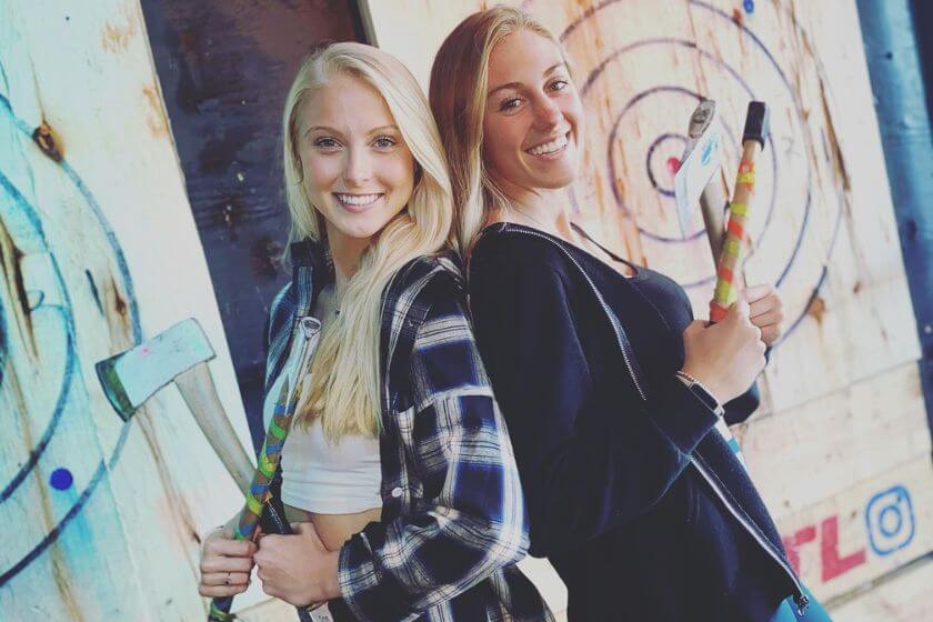 girls posing with twin axes