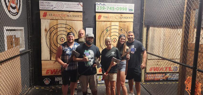 group of people axe throwing
